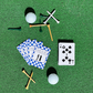 Golf-inspired blue checkered playing cards by Aced It Co., designed for game nights, golf trips, and clubhouse gatherings. on a green turf with golf tees and golf balls