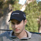 a black Golf Is Therapy embroidered golf hat by Aced It Co., a casual accessory for golf lovers.