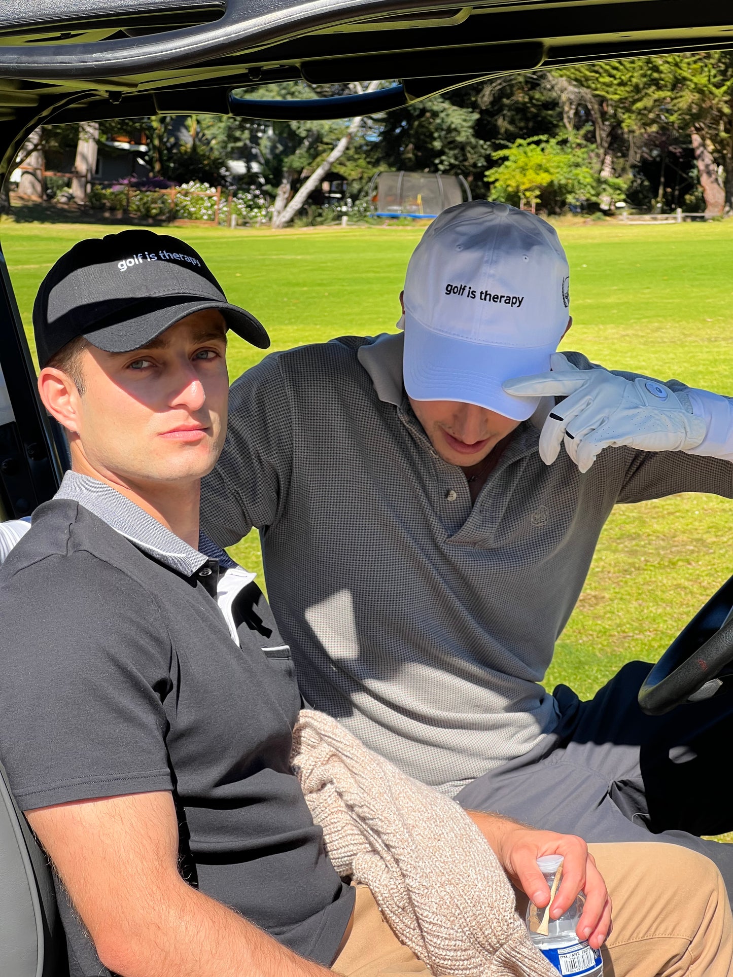Golf Is Therapy dad hat by Aced It Co., a golf lifestyle accessory featuring embroidered lettering. modeled by two males with a white and a black hat