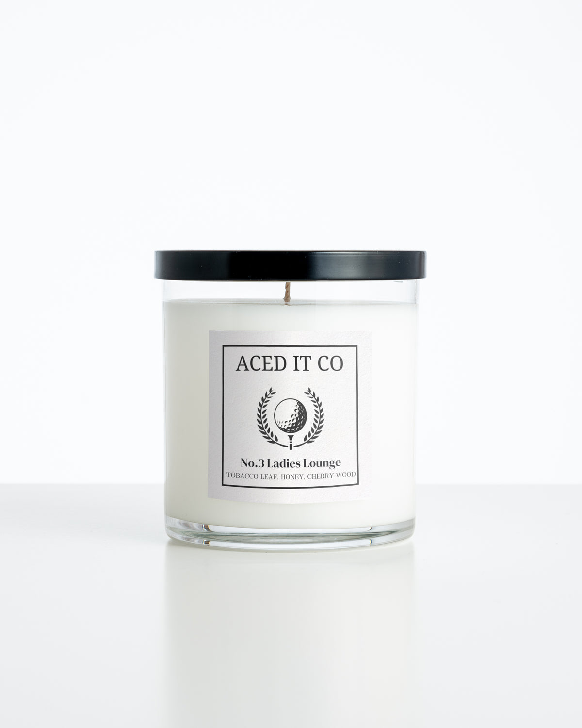 Aced It Co. Ladies Lounge golf-inspired candle with a golf ball label.