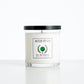 Aced It Co. The First Cut golf-inspired candle in a glass jar, featuring a green golf ball label.